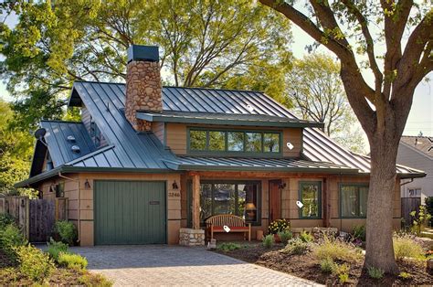 yellow cedar house with green trim and green metal roof|green roof colors.